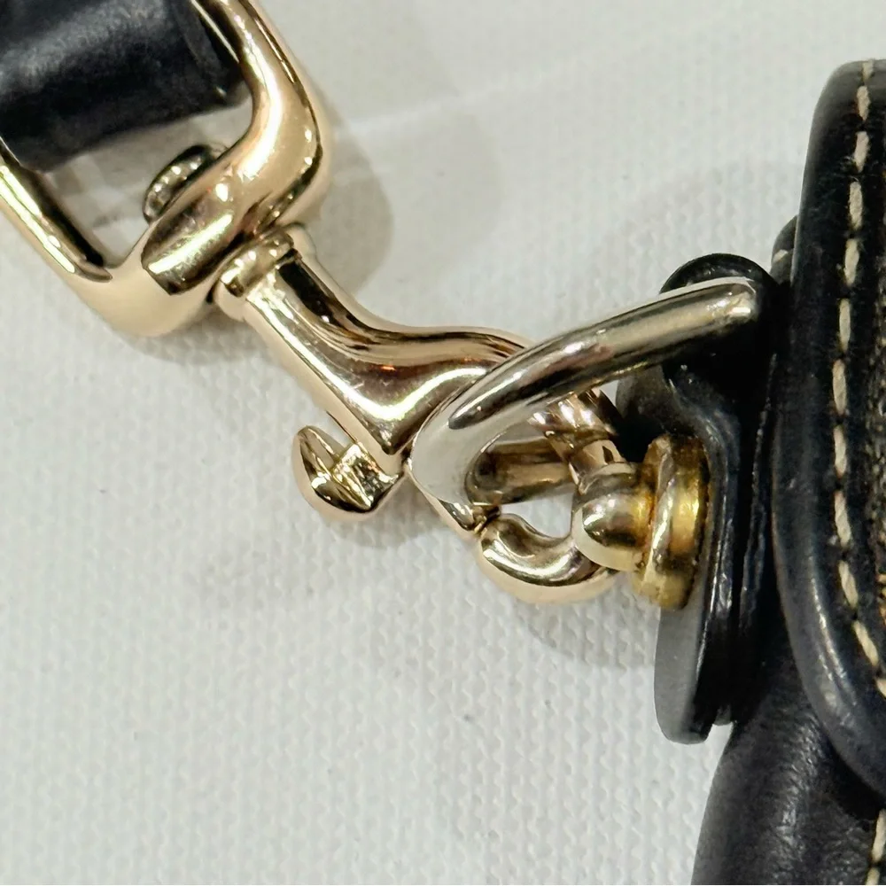 Dooney & Bourke Monogrammed Tan and Black Wristlet Clutch